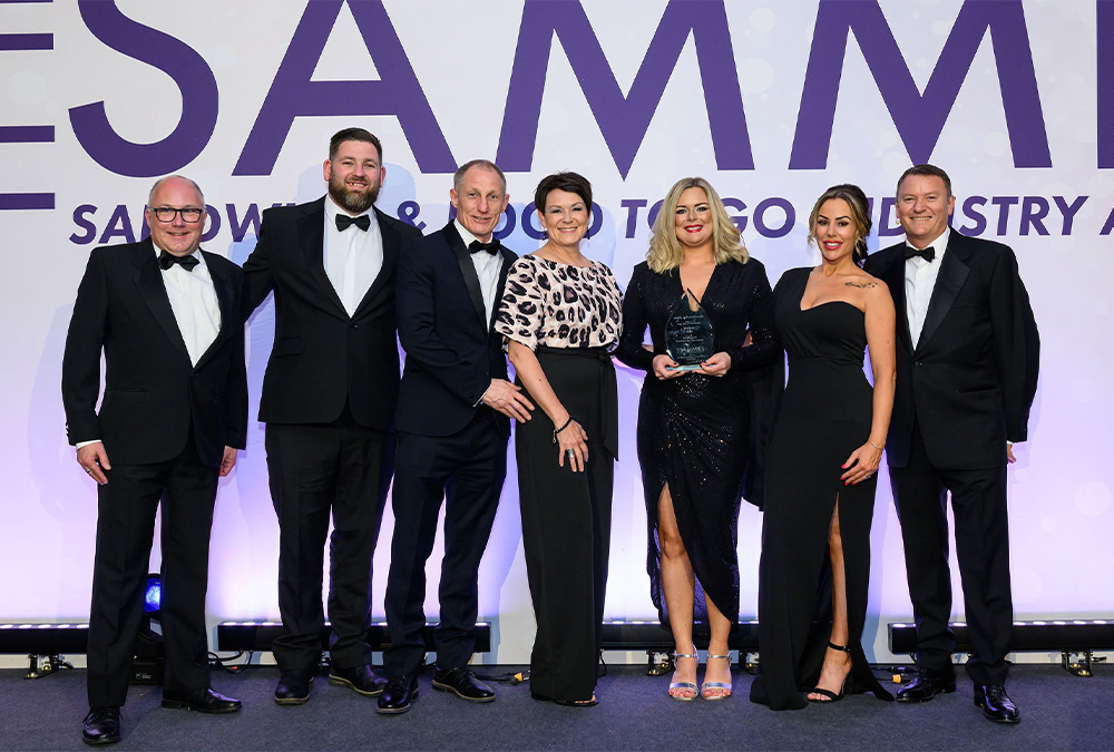 Holly Francis holding the Sammies Business Development Award, together with members of the Flexeserve team and Adele Rooney, King's Fine Cooked Meats (sponsors of the award) and celebrity chef, Theo Randall